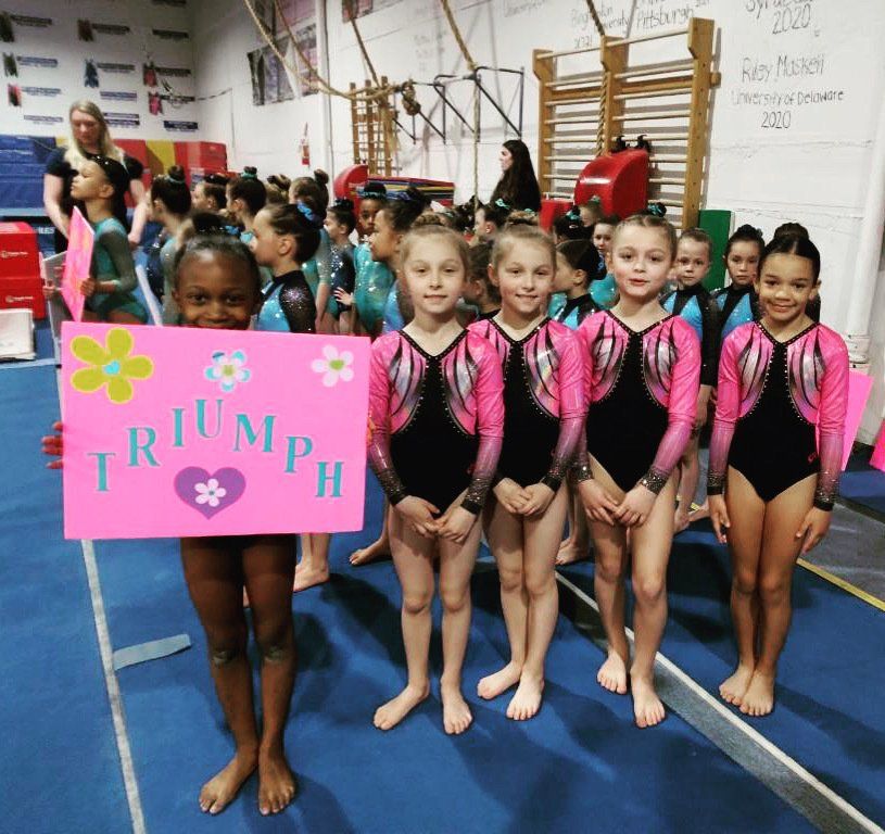 Young gymnast practicing on the floor at Triumph Gymnastics