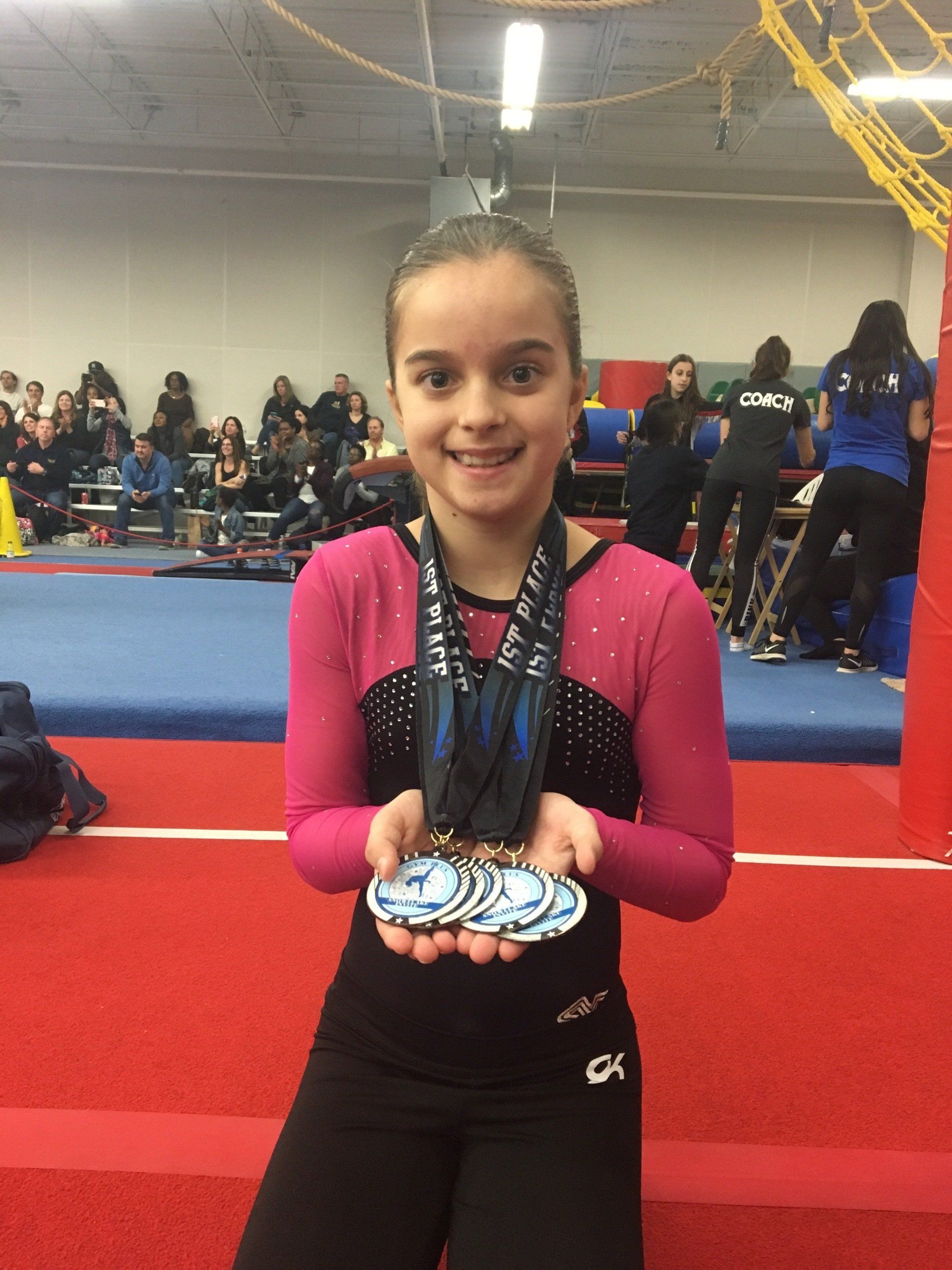 Beginner gymnast learning on the beam
